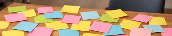 Postit Notes Covering Table Surface